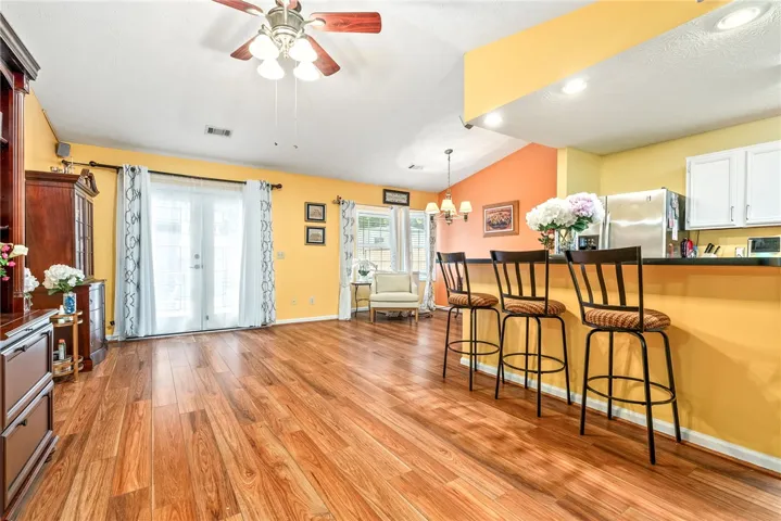 This inviting space features durable hardwood flooring and convenient access to the outdoors.