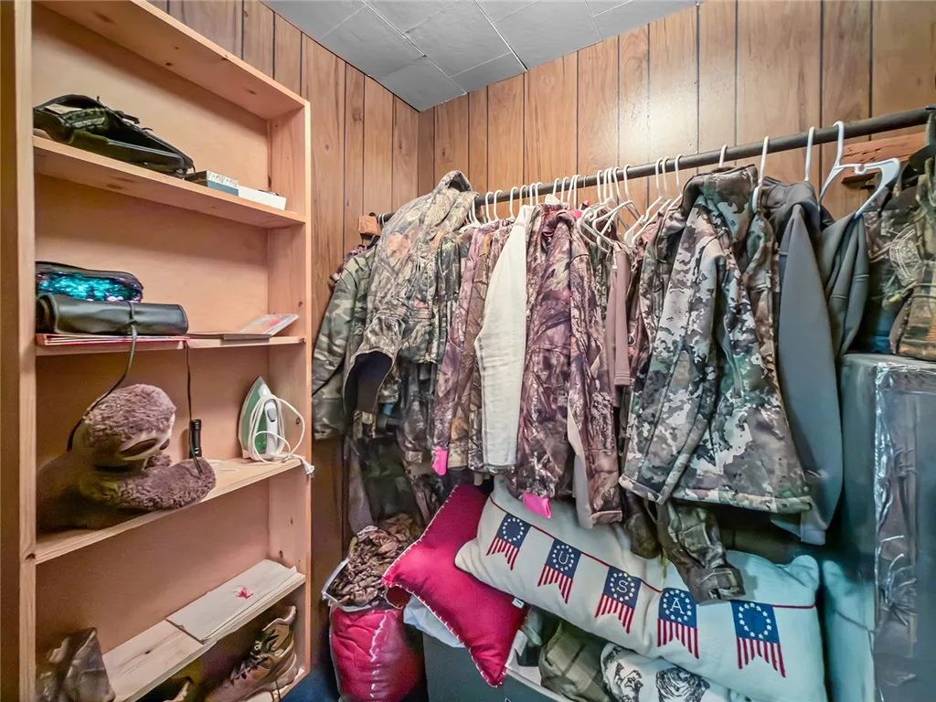 This organized closet features ample shelving, offering practical storage solutions for any household.