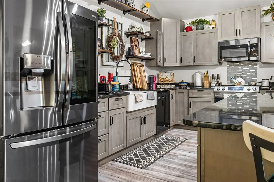 This spacious kitchen offers ample cabinetry, modern appliances, and a convenient island for culinary adventures.