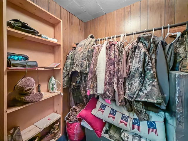 This organized closet features ample shelving, offering practical storage solutions for any household.