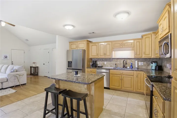 This kitchen blends seamlessly into the living space, offering both comfort and practicality for daily life.