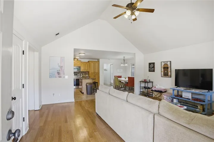 This inviting space features an open layout connecting living, dining, and kitchen areas.