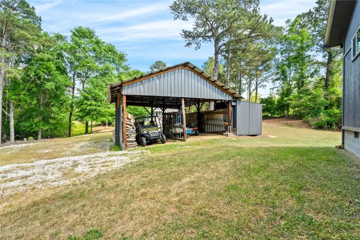 This spacious yard features a versatile storage shed, perfect for outdoor equipment.