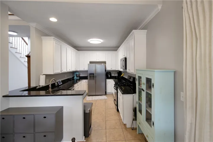 Bright and open kitchen with modern appliances and ample storage.