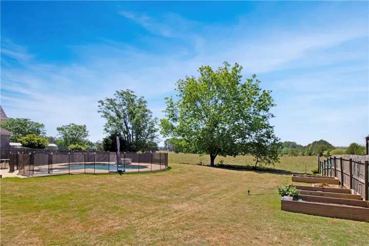 This spacious yard features a private pool, perfect for outdoor enjoyment and​​‌​​​​‌​​‌‌​‌‌​​​‌‌​‌​‌​‌​​​‌​​ relaxation.