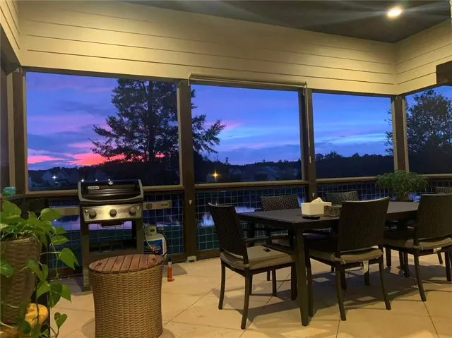 This inviting porch offers tranquil water views, perfect for evening gatherings.