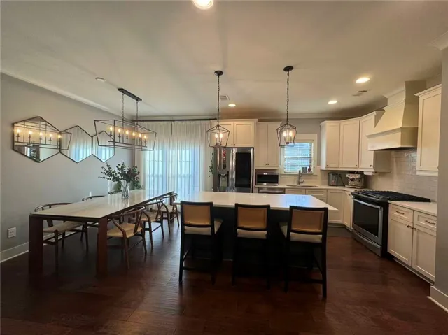 This spacious area seamlessly combines cooking and dining for effortless living.