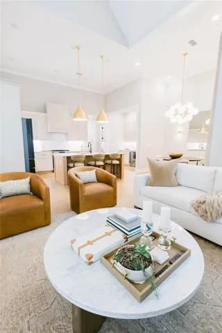 This bright, open concept living space seamlessly integrates with the adjacent kitchen.