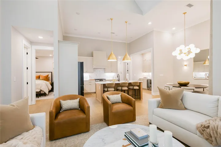 This open concept living area seamlessly connects to the kitchen and dining space, perfect for entertaining.