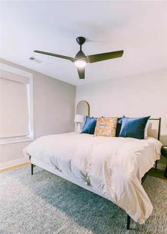 This spacious bedroom offers a tranquil retreat for ultimate relaxation and comfort.