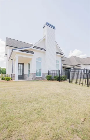 This captivating exterior features a stylish facade with clean lines and inviting outdoor space.