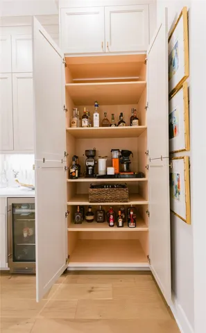 This cabinet provides both storage and a sophisticated beverage station.