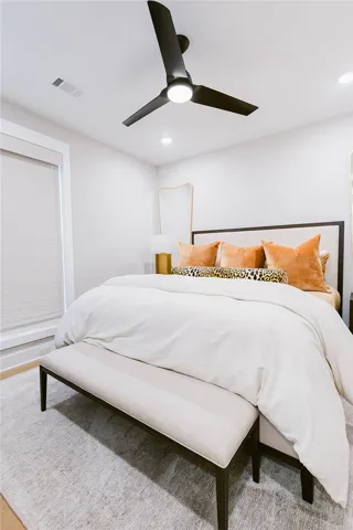 This serene bedroom offers a tranquil retreat with soft lighting and a calming ambiance.
