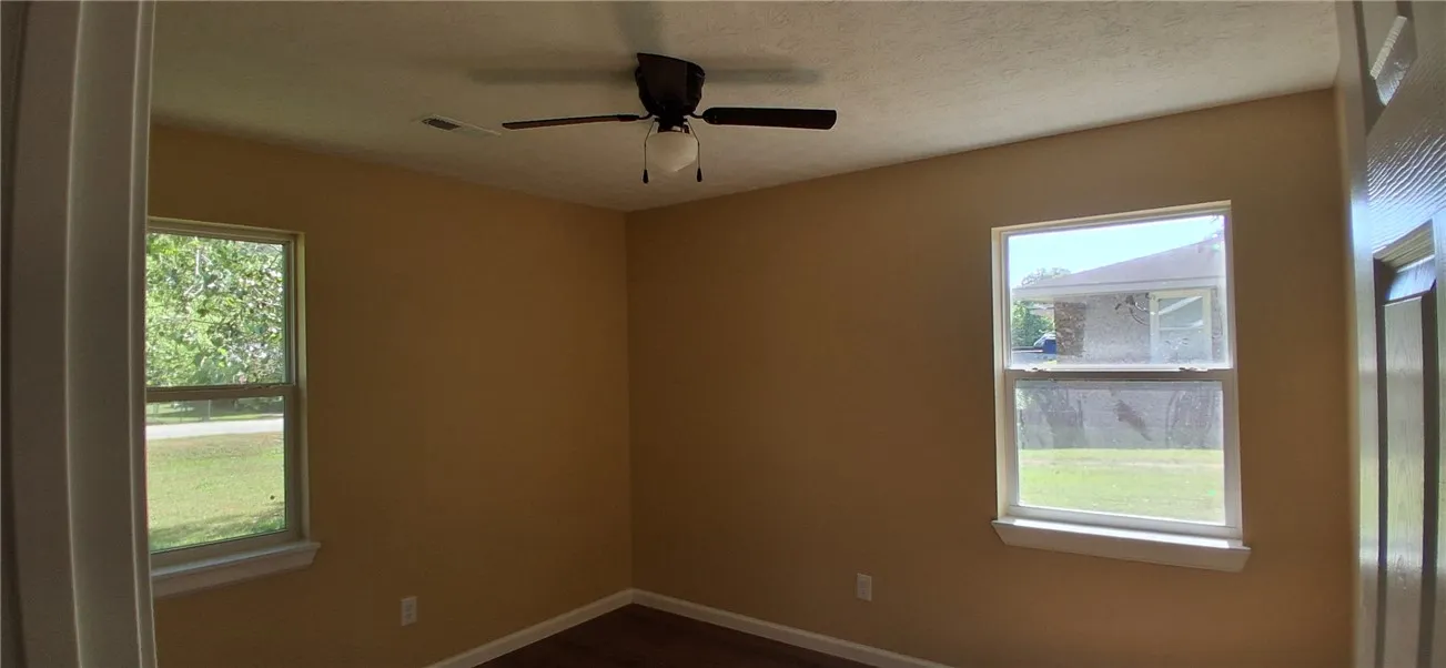 This bedroom  with overhead fan, perfect for relaxation.