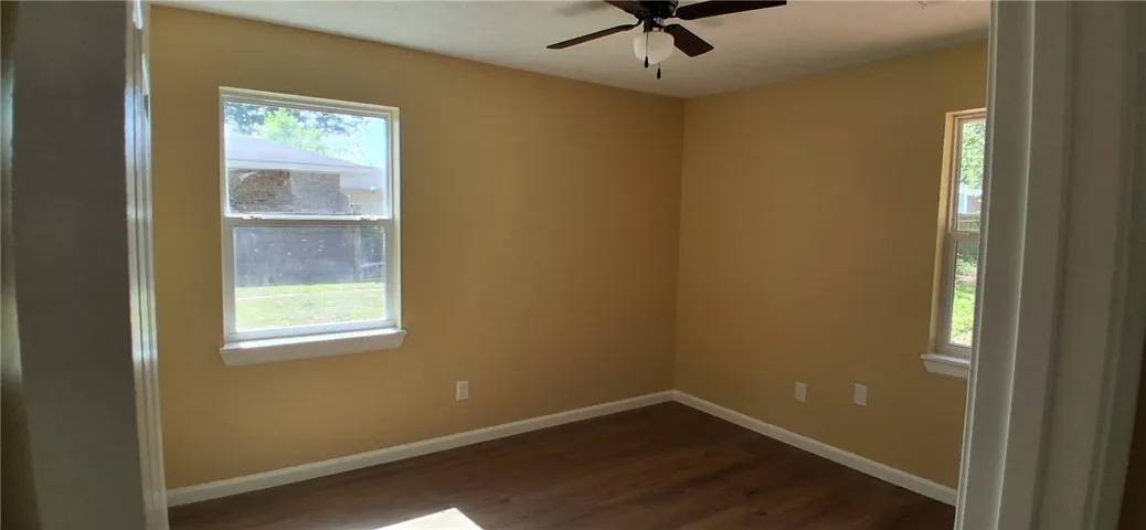 This bedroom with overhead fan, perfect for relaxation.