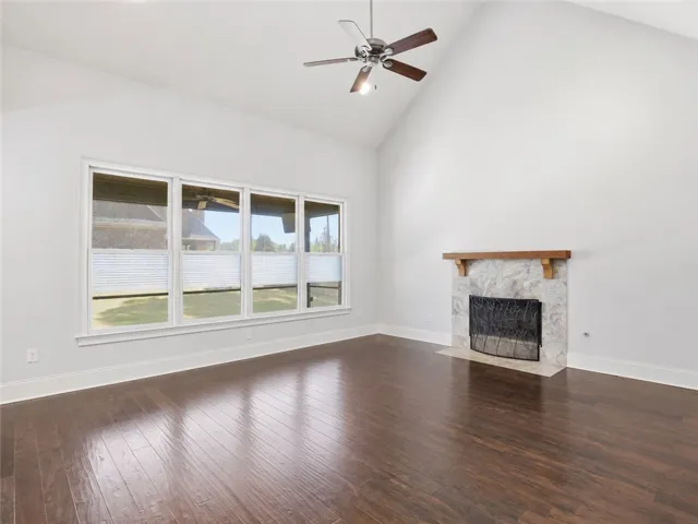 Vaulted ceilings amplify the generous space in this inviting living room.