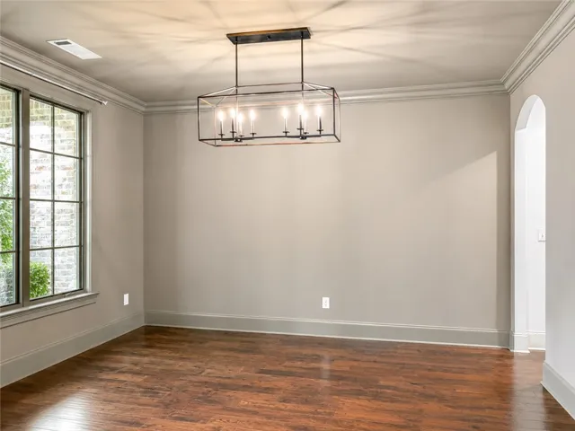 Hardwood floors and generous natural light create an inviting atmosphere.