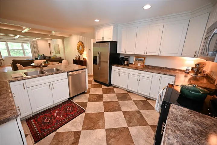 Open kitchen flows seamlessly into breakfast area & great room, perfect for daily living.
