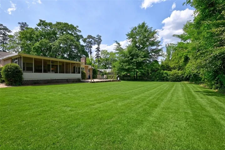 Outdoor living areas include a screened porch as well as an open patio.
