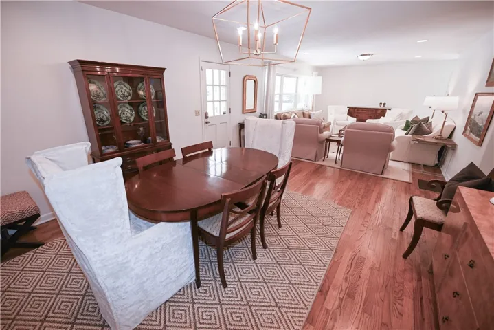 Formal dining with formal living in background.