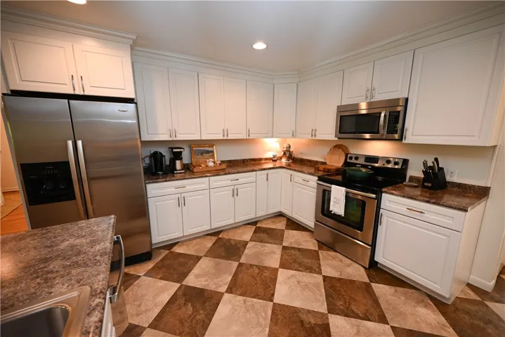 Spacious kitchen featuring ample cabinetry & modern appliances.