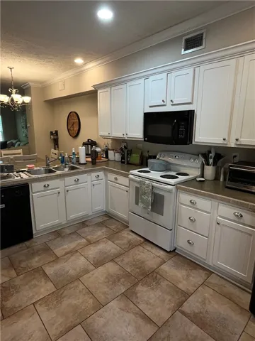 This spacious kitchen offers ample cabinetry and an open layout for effortless living.