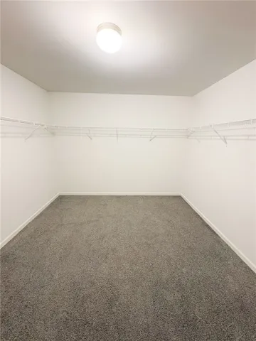 The primary room - spacious walk-in closet offers ample storage potential.