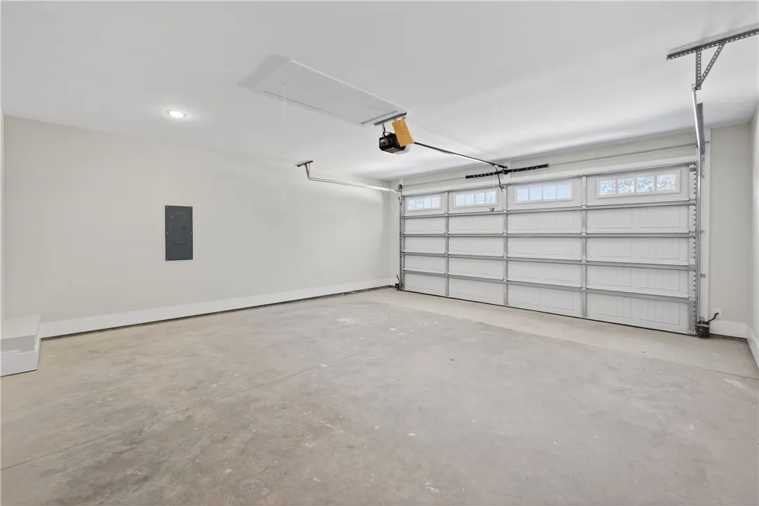 This spacious garage offers ample parking and additional storage solutions for your needs.