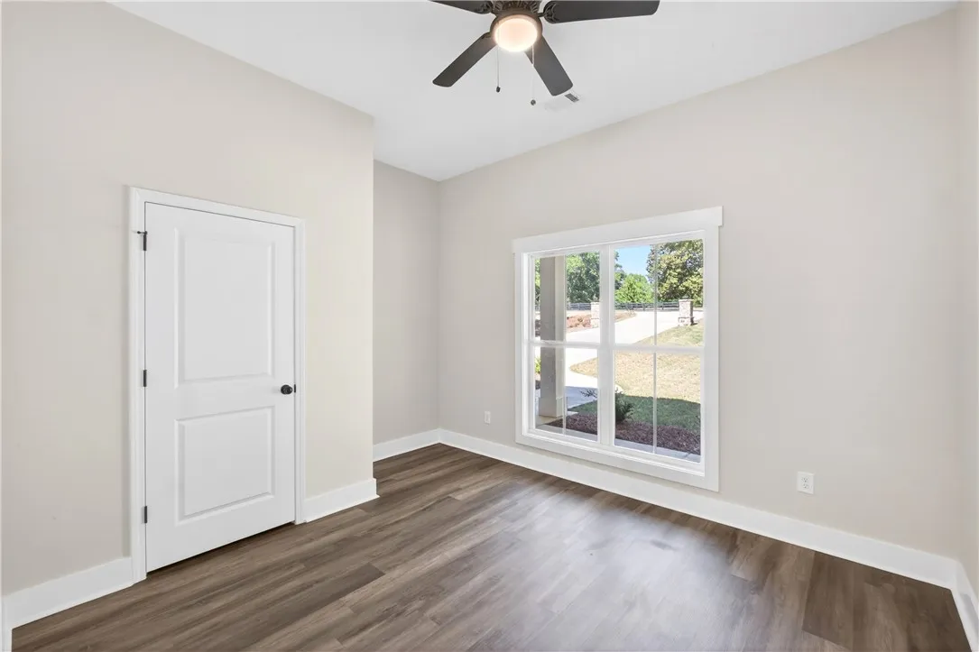 Bright and airy room with durable flooring and natural light.