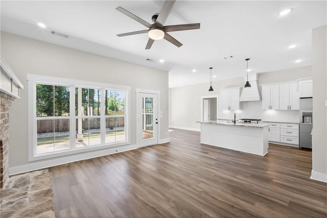 This bright and open-concept home features seamless flow between living spaces and direct backyard access.