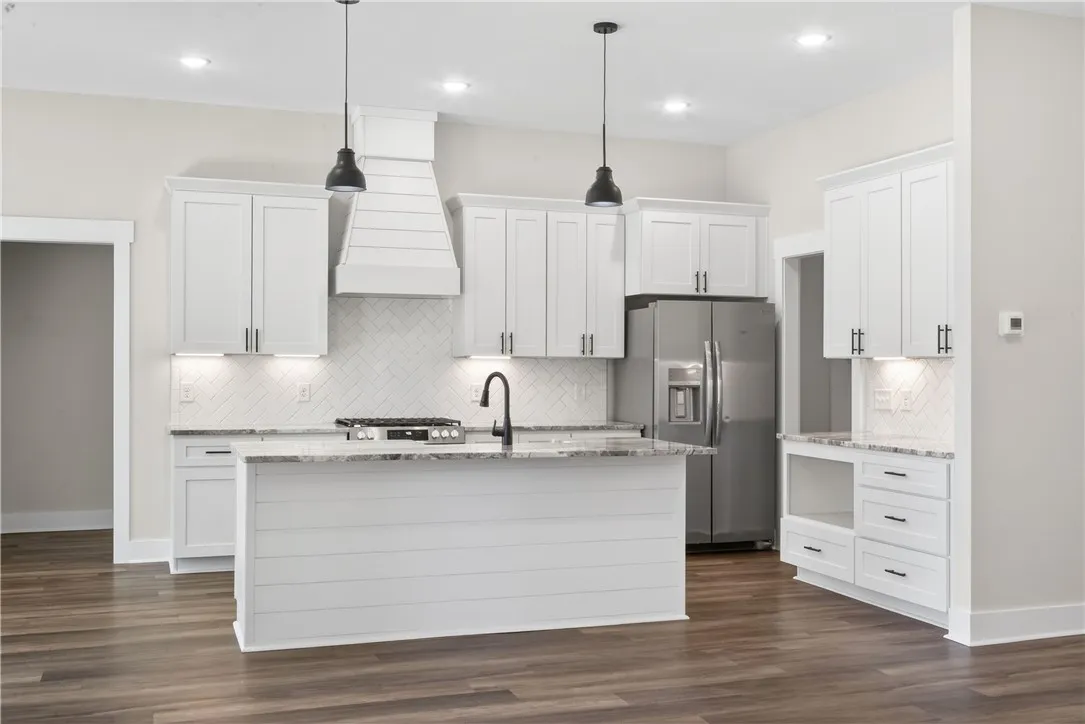 Bright and open kitchen with modern finishes and convenient island.