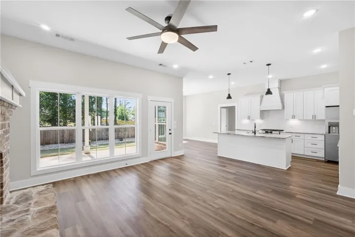 This bright and open-concept home features seamless flow between living spaces and direct backyard access.