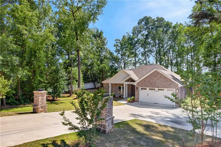 This charming home features a brick and siding exterior, offering both durability and timeless appeal.