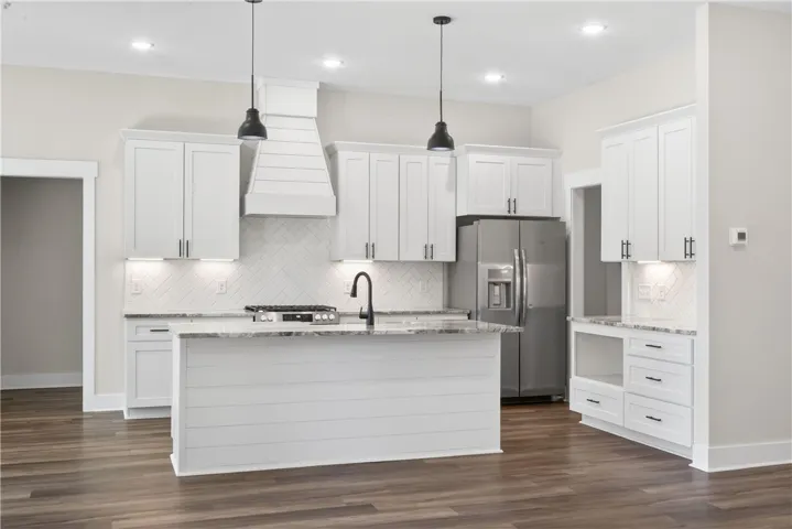 Bright and open kitchen with modern finishes and convenient island.