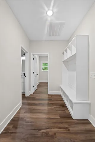 This spacious entryway features abundant storage and seamlessly connects to other rooms.