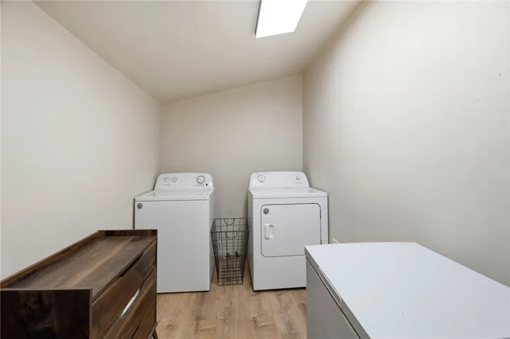 This dedicated laundry space combines practicality with comfort for everyday chores.