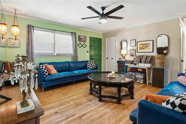 This inviting living area boasts rich hardwood floors and abundant natural light.