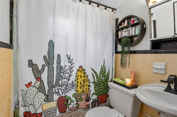 This bathroom features classic tile work and a sleek modern sink.