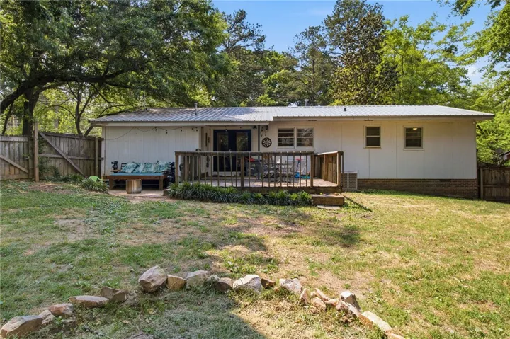 Enjoy outdoor living on the back deck of this charming home.