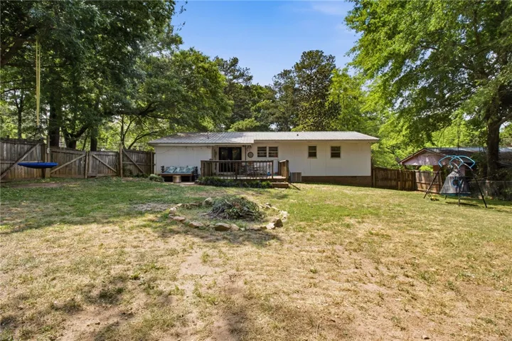 This private yard offers an outdoor living area and plenty of space for activities.