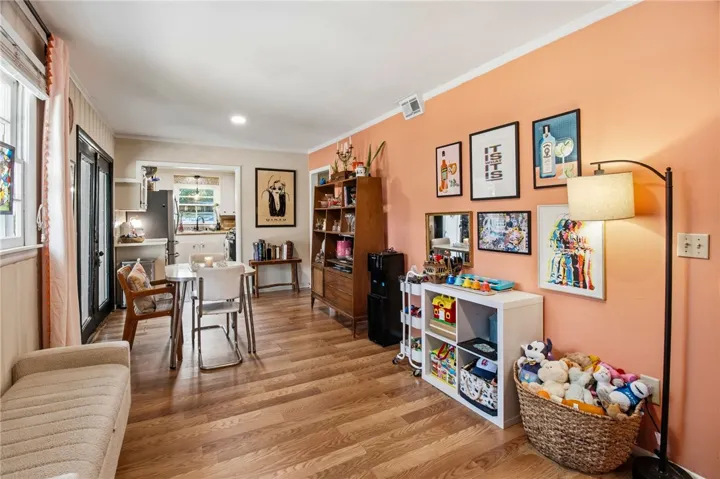 This living space offers an inviting atmosphere with natural light and a seamless flow.