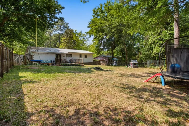 This spacious backyard offers ample room for outdoor activities and relaxation.