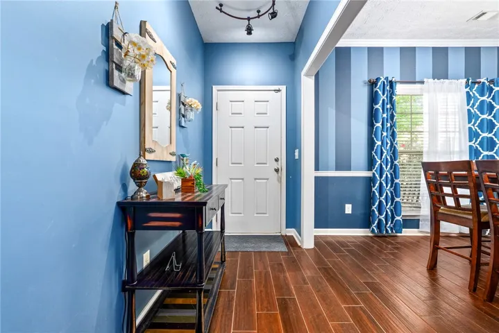 This entry welcomes all with durable wood flooring.
