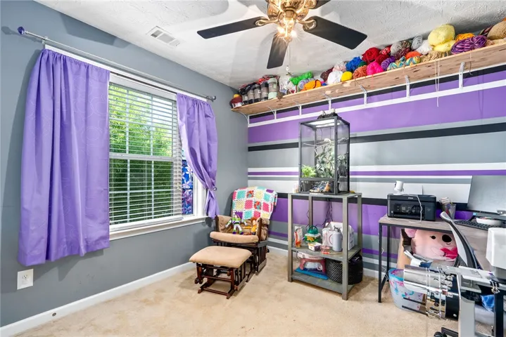 This cozy room offers comfort and ample natural light, ideal for peaceful relaxation.