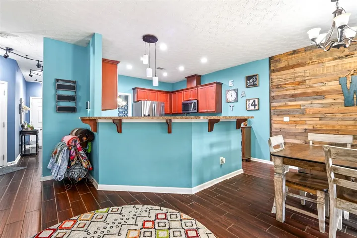 This spacious kitchen and dining area offers functional design and stylish finishes for everyday living.