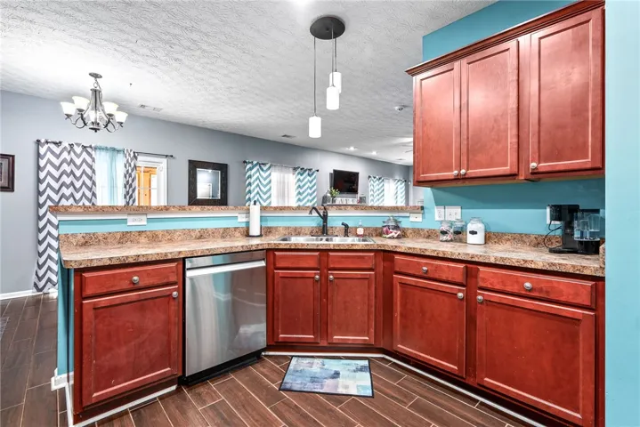 This spacious kitchen offers ample cabinet space and modern appliances for culinary pursuits.