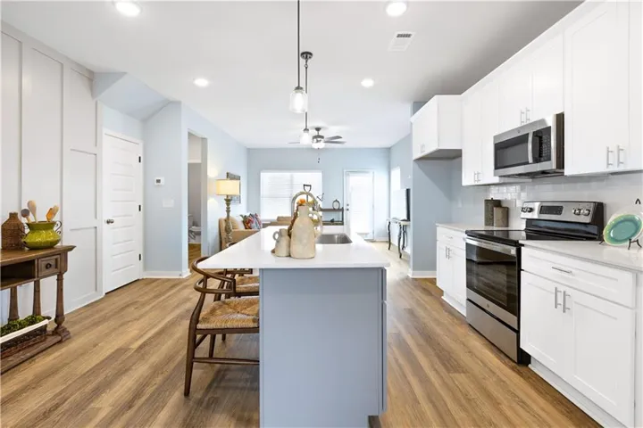 This open concept kitchen flows seamlessly into the living space, perfect for everyday living.
