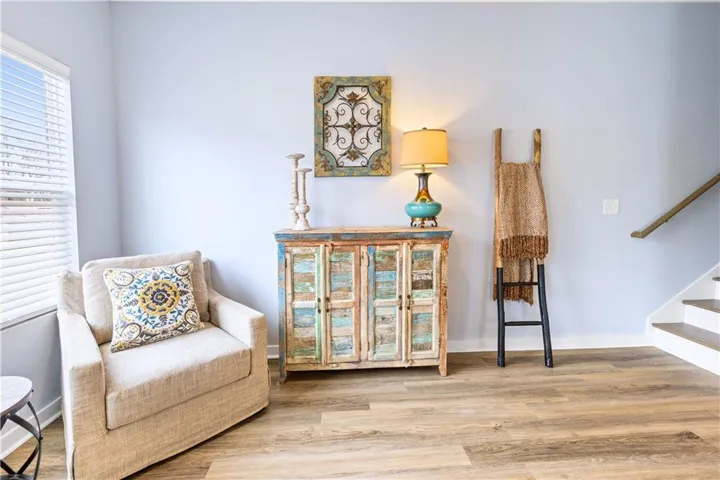 This inviting space features durable flooring and a bright window, perfect for comfortable living.