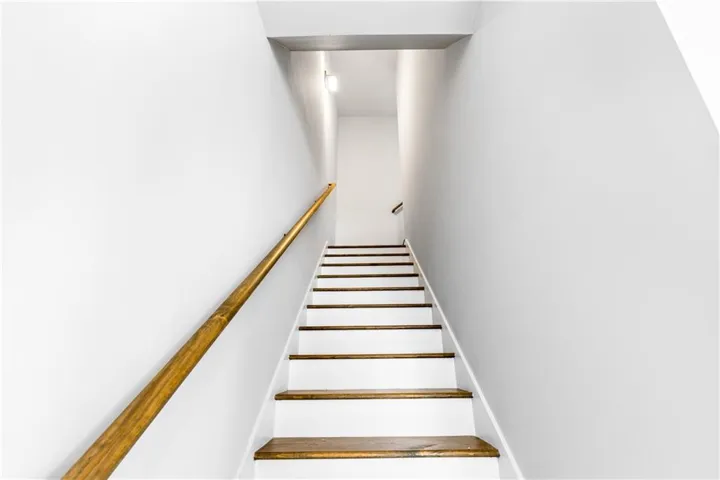 This interior staircase offers a graceful transition between floors.