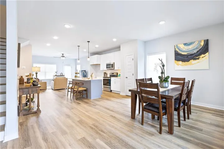 This bright and open space seamlessly connects kitchen, dining, and living areas.